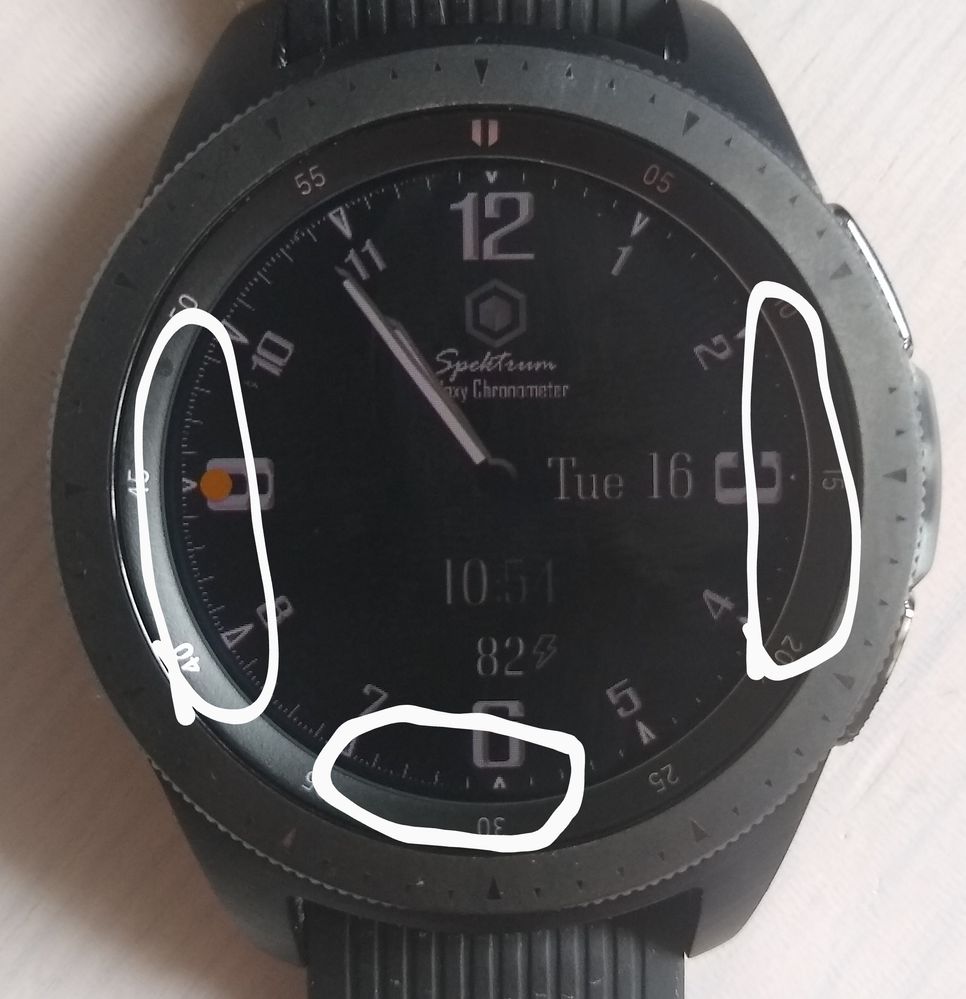 At the left you can see the edge of the watch face, but at the right you can't.