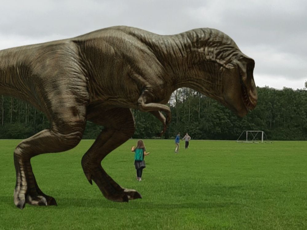 Me and friends running away from a t-rex (I am the one in the blue coat)
